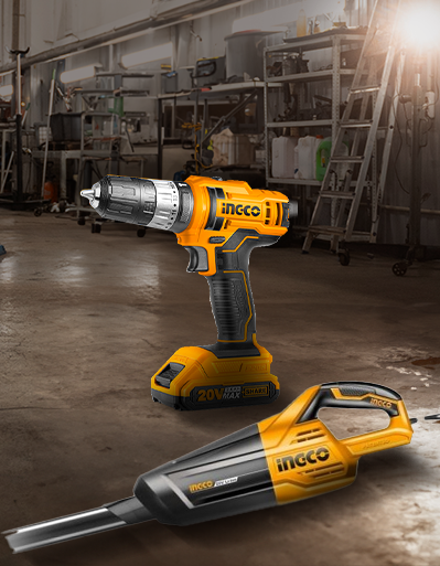 Taladro inalámbrico con herramienta de impacto para proyectos de bricolaje y construcción. Taladro inalámbrico y herramienta de impacto amarillos en un taller, para proyectos de bricolaje y trabajos de construcción.